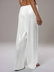 Vue arrière du pantalon large à paillettes blanches et taille haute pour femmes