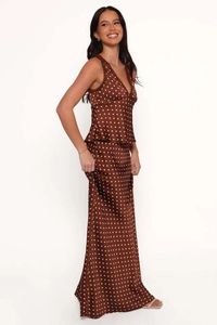 Detailed view of brown polka dot satin top with delicate lace V-neckline and skirt