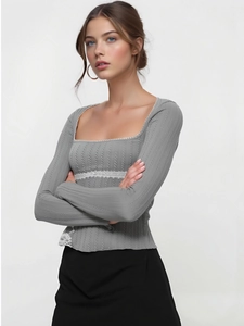 Close-up of square neck grey ribbed top with intricate white lace stitching details