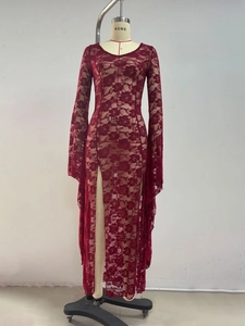 Detailed view of burgundy floral lace fabric with elegant high side slit and flared sleeves