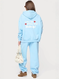 Light blue hoodie and sweatpants set with 'Call me when you wakeup' print on the back