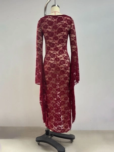 Detailed macro view of sheer burgundy floral lace fabric and flare sleeves on the dress