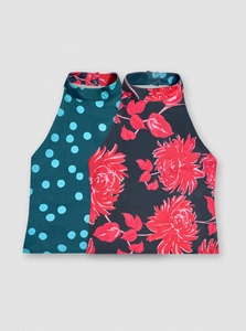 Detail of elegant halter sleeveless tops with floral and polka dot reversible patterns