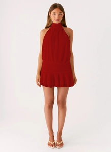 Front view of red halter neck sleeveless mini dress with fine knitted texture