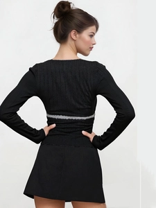 Detail view of black long sleeve top with unique grey faux fur stripe on the back