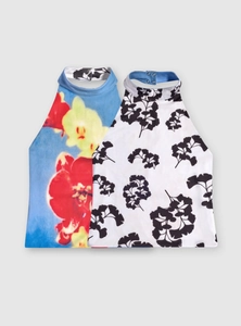 Detail of halter neck tops featuring floral and ginkgo leaf prints with button closure