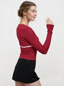Close-up of red cable knit long sleeve tee with lace splicing and square neckline