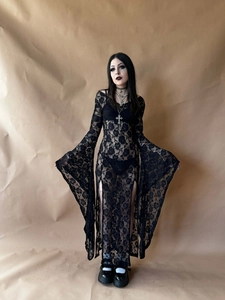 Close-up of black lace dress featuring rose patterns and elegant wide bell sleeves