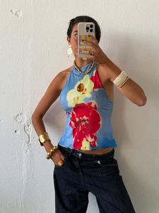 Halter neck floral top with vibrant sky blue base and irregular hemline detail