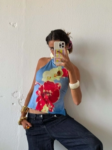 Elegant halter neck top with large red flower print and irregular hem for casual wear