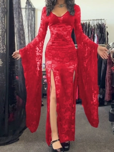 Detail of red lace dress featuring deep V-neck, flared bell sleeves, and double high slits