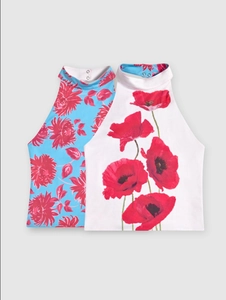 Detail of elegant halter neck sleeveless tops showing floral prints and metal back buttons