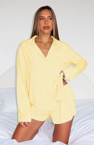 Close-up of lightweight pale yellow long-sleeve pajamas shirt with soft button details