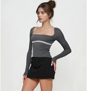 Detail of square neck long sleeve top with white lace trim and ribbed texture fabric