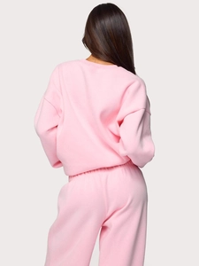 Pink two-piece tracksuit featuring a crew neck sweatshirt and drawstring joggers for women