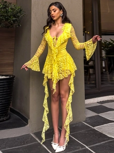 Detail of V-neck lace dress with ruffle neckline and flared sleeves in bright yellow