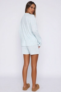 Detail view of the light blue heart print pajama set showing the back fit and soft fabric