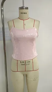 Close-up of pink sequined camisole top featuring shiny reflective fabric and thin straps