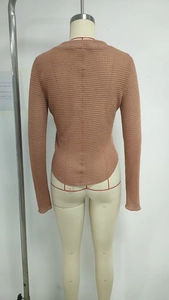 Detail view of pink waffle knit long sleeve top back side with slim fit textured fabric