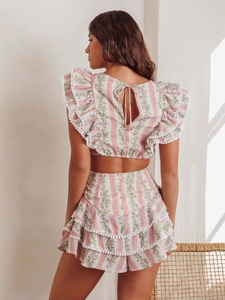 Bohemian two-piece floral set with ruffle flutter sleeves and pom-pom trim detail