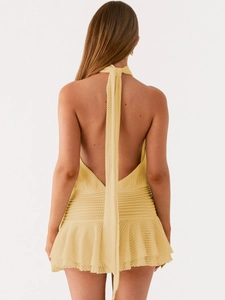 Chic beige halter backless knitted mini dress with elegant ruffle hem and ties