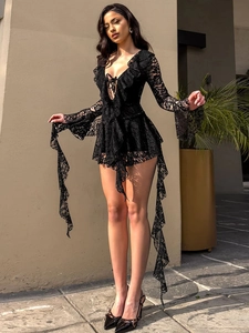 Detail of V-neck lace mini dress showing intricate crochet textures and ruffled cuffs