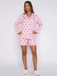 Pink long sleeve pajama set with red lip print and matching shorts for women