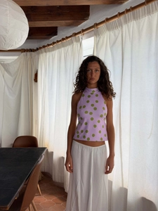 Detail of lavender halter neck polka dot top showing green pattern and soft knit texture