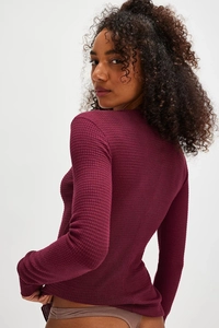 Detailed back view of a slim fit waffle knit cardigan in deep burgundy color