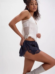 Women's two-piece sleepwear set featuring a lace camisole and satin shorts in navy blue