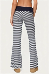 Detail view of high-waist striped flare pants with contrasting blue waistband for women