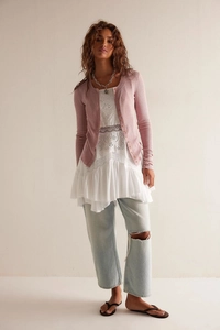 Detailed close-up of pink waffle knit cardigan and white floral lace embroidery top