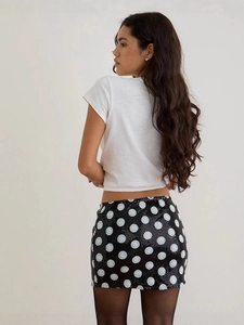 Sexy slim fit sequin mini skirt with white polka dots on black fabric and cropped t-shirt
