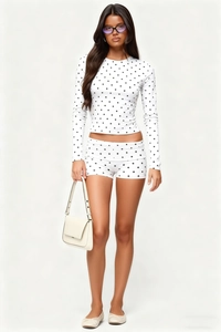 Polka dot loungewear set featuring long sleeve crewneck top and slim shorts for women