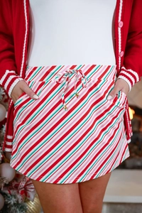 Detail of candy cane striped Christmas skirt showing drawstring waist and side pockets