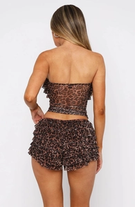 Back view of leopard print two-piece set featuring ruffled trim and layered mesh fabric