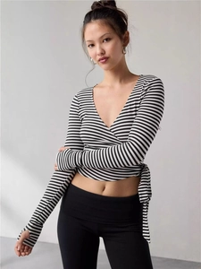Striped long sleeve wrap top with V-neck, waist tie, and thumbholes for women