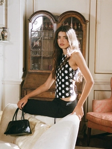 Chic sleeveless top with sequins and large polka dots in a retro modern style for women