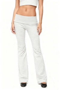 Close-up of high-waist striped flared trousers with a stylish fold-over waistband detail