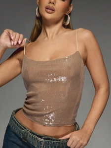 Detailed view of champagne sequins and thin straps on a slim-fit party camisole top