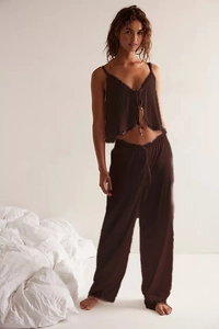 Detail of chocolate brown camisole and pants with delicate lace trim on the hem
