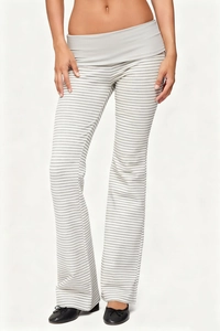 Detail view of high waist striped flare pants with a grey and white folded waistband