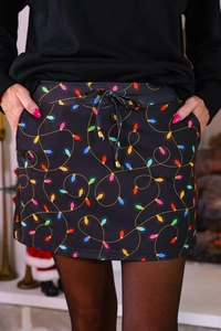 Detail view of high waist Christmas skirt with colorful light bulbs and drawstring