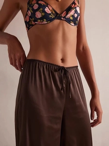 Women's brown satin wide-leg pajama pants with elastic drawstring waist and elegant drape