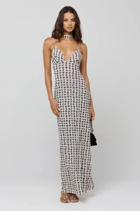 Macro shot of polka dot pattern on the V-neck slimming maxi dress with neck accessory
