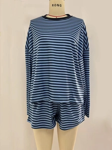 Detail of blue and black striped loungewear set featuring long sleeve top and shorts