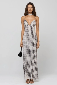 Detail view of a slim fit V-neck polka dot maxi dress with matching choker accessory