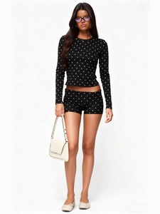 Women black polka dot two-piece set with long sleeve crop top and slim fit shorts