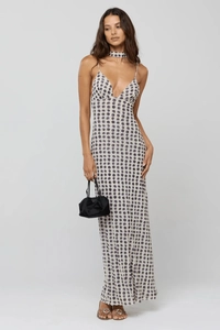 Detail shot of long polka dot halter dress with deep V-neck and matching choker
