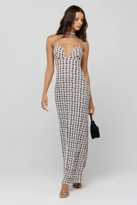 Close-up of a stylish backless polka dot maxi dress with a deep V-neck and matching choker